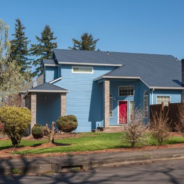 picture of a blue house from the road